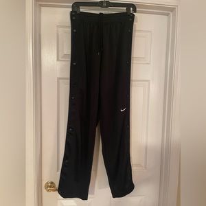 Nike Black with red inseam snap pants.  Size 4-6 (small)